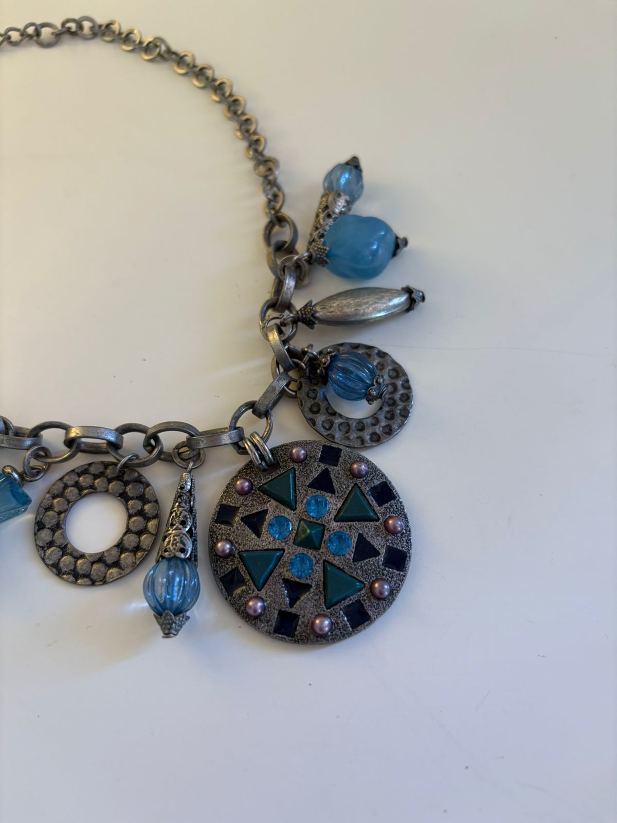 Silver toned charm collar necklace
