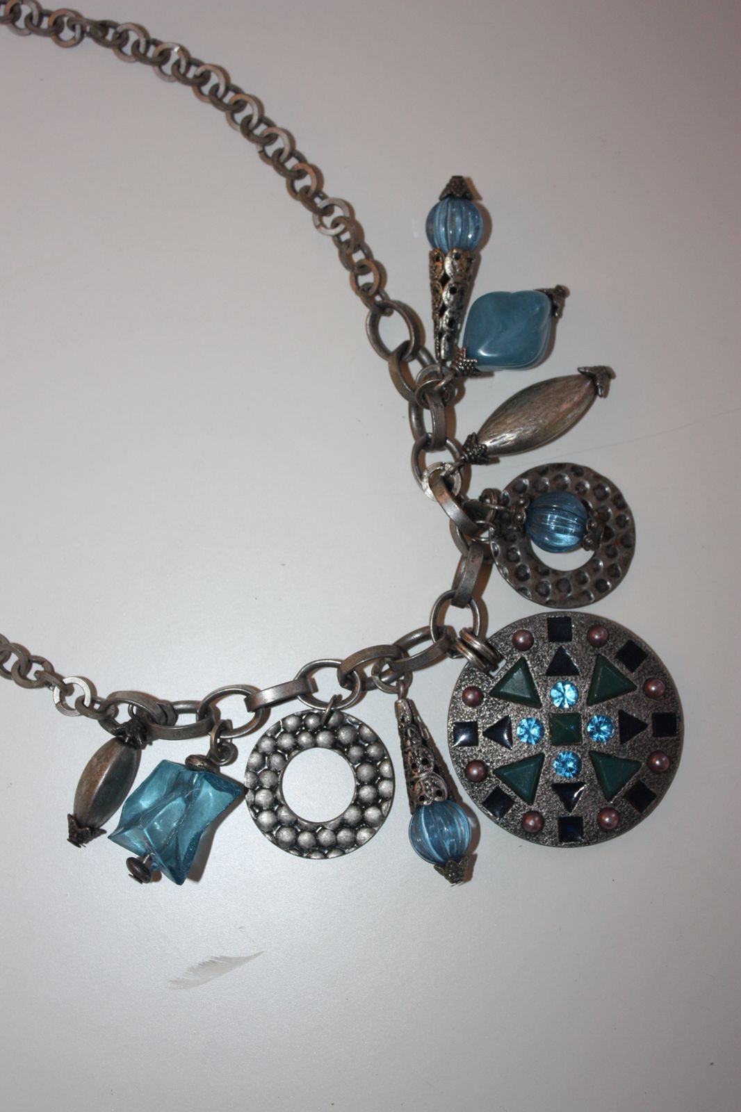 Silver toned charm collar necklace