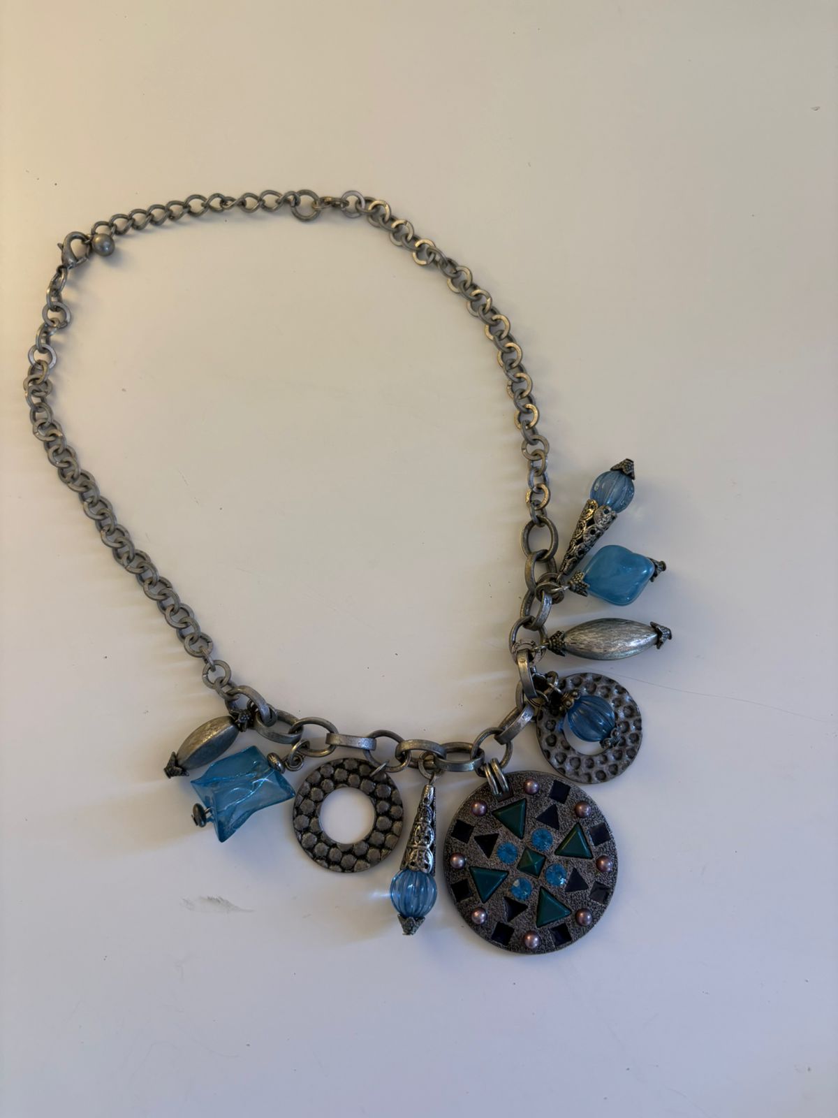 Silver toned charm collar necklace