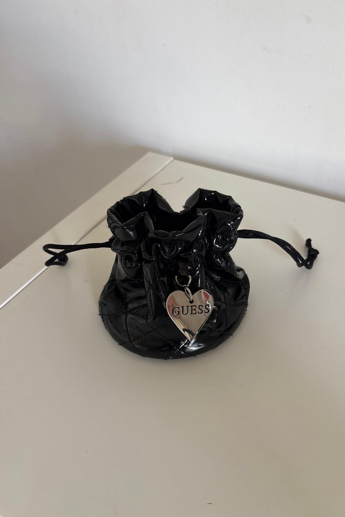 Guess patent mini jewelry pouch