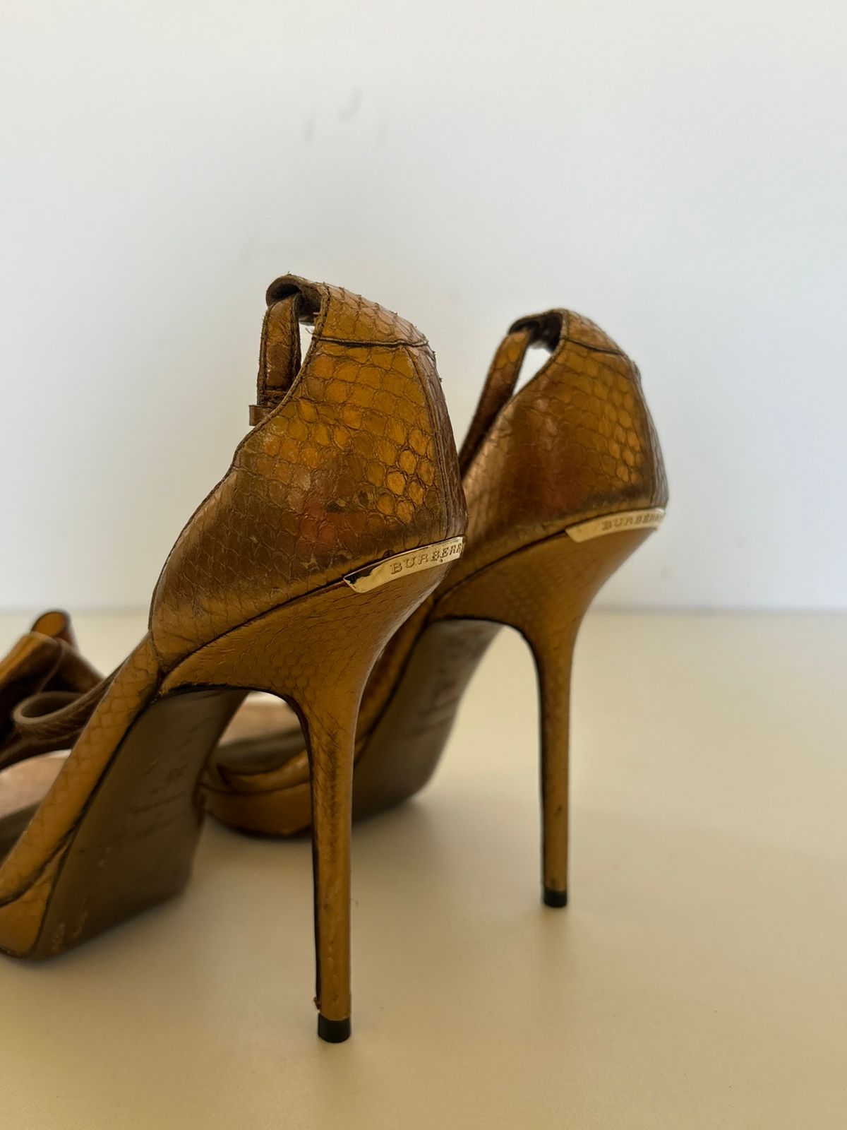 Burberry python leather platform bow